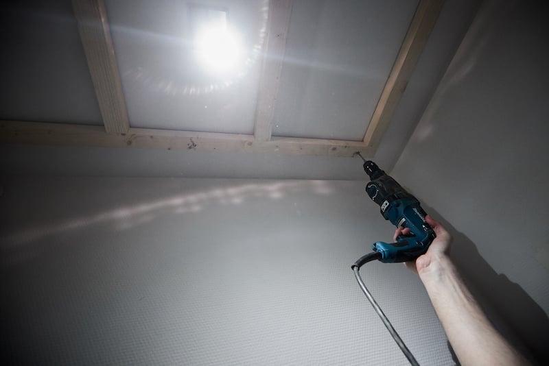 Mounting the frame to toilet ceiling