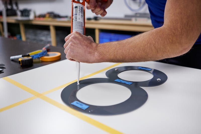 Making house numbers assemble with sealant